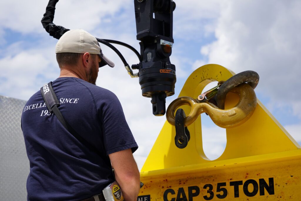 Wingfield Scale technician working with heavy-duty 35-ton equipment, showcasing the company’s in-house expertise in handling complex projects with precision and reliability