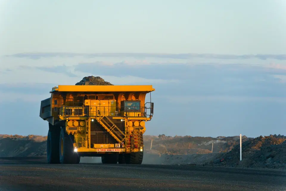Mining haul trucks at a platform scale illustrating elimination of queues and calibration downtime